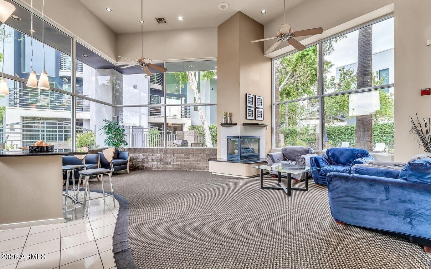 3633 North 3rd Avenue, Unit 1043 Phoenix, AZ 85013 - Photo 14 of 14 a living room with furniture and a large window