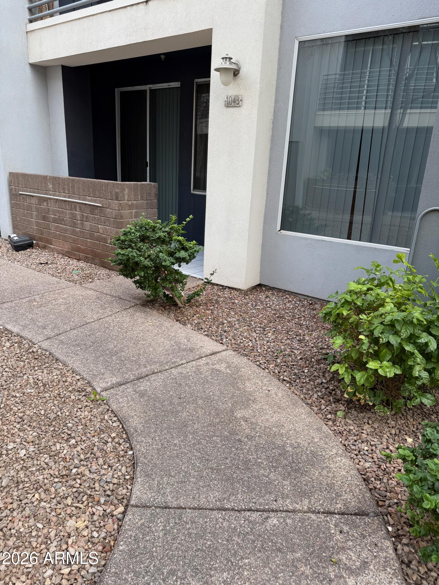 3633 North 3rd Avenue, Unit 1043 Phoenix, AZ 85013 - Photo 4 of 14 a front view of a house with a yard