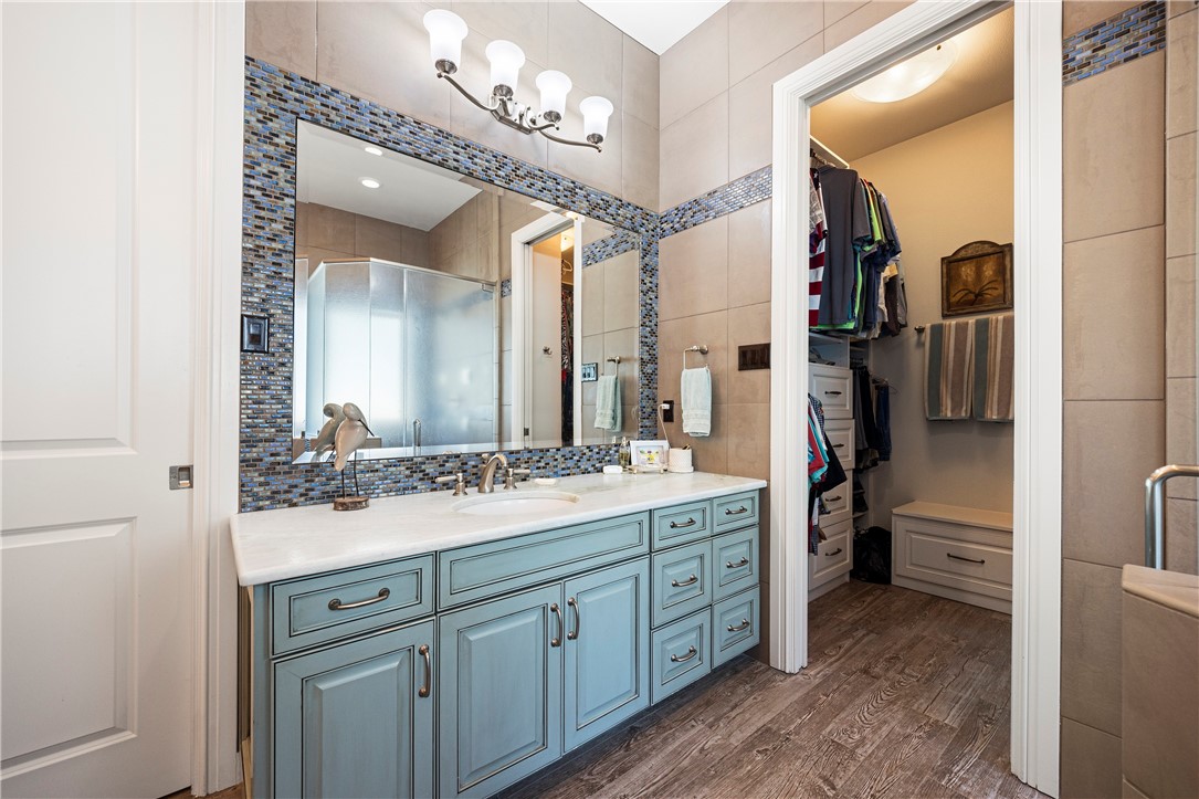 13806 Captains Row Corpus Christi, TX 78418 - Photo 16 of 40 a bathroom with a double vanity sink and a mirror