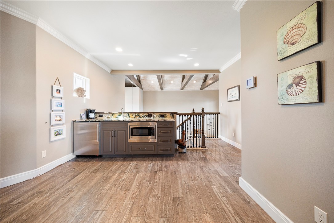 13806 Captains Row Corpus Christi, TX 78418 - Photo 21 of 40 a kitchen with stainless steel appliances a stove and a refrigerator
