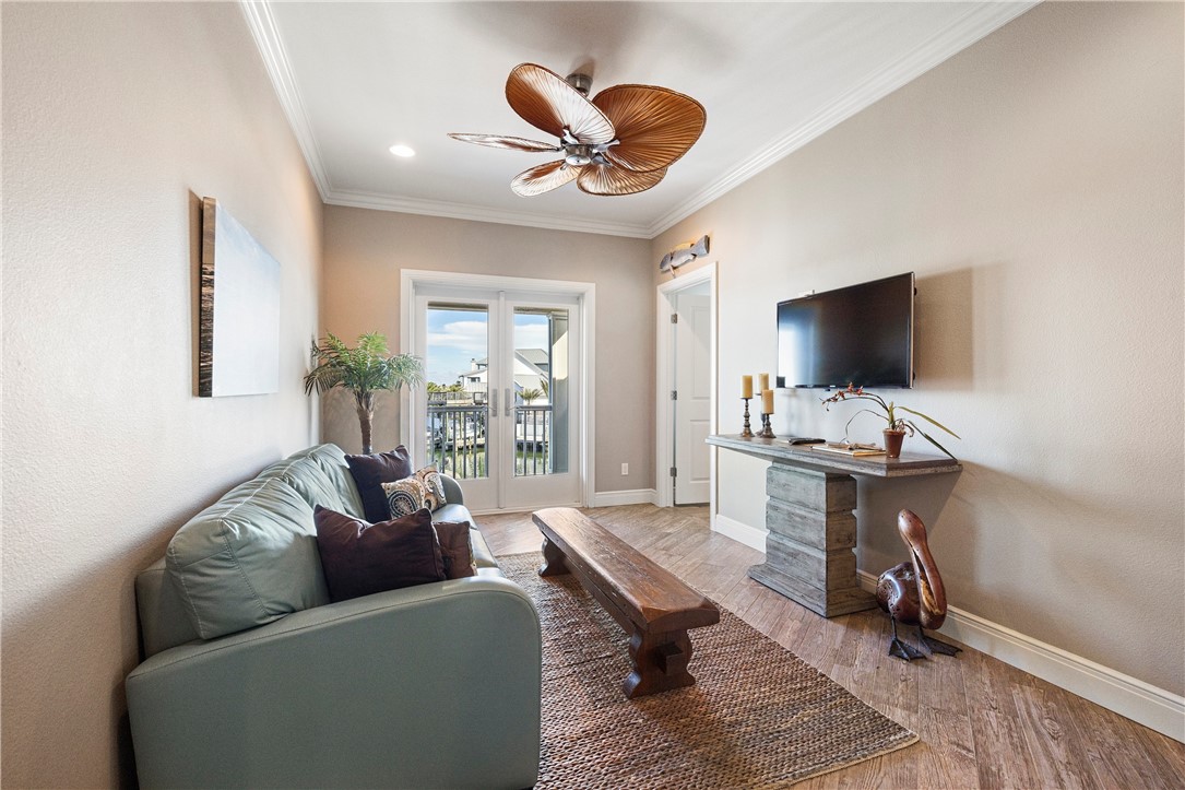 13806 Captains Row Corpus Christi, TX 78418 - Photo 22 of 40 a living room with furniture and a flat screen tv