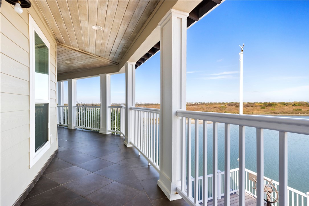 13806 Captains Row Corpus Christi, TX 78418 - Photo 30 of 40 a view of a porch with a floor to ceiling windows with wooden floor