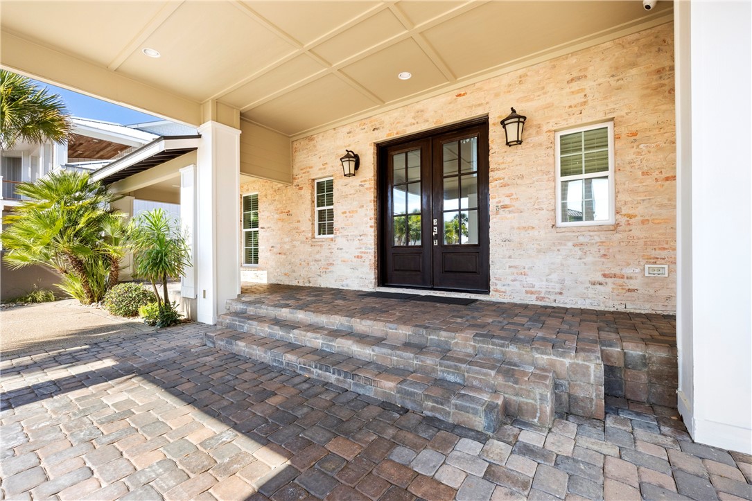 13806 Captains Row Corpus Christi, TX 78418 - Photo 3 of 40 a view of a entrance door of the house