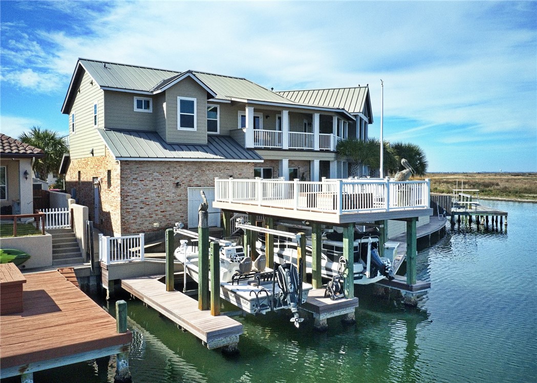 13806 Captains Row Corpus Christi, TX 78418 - Photo 39 of 40 a view of house with swimming pool outdoor seating