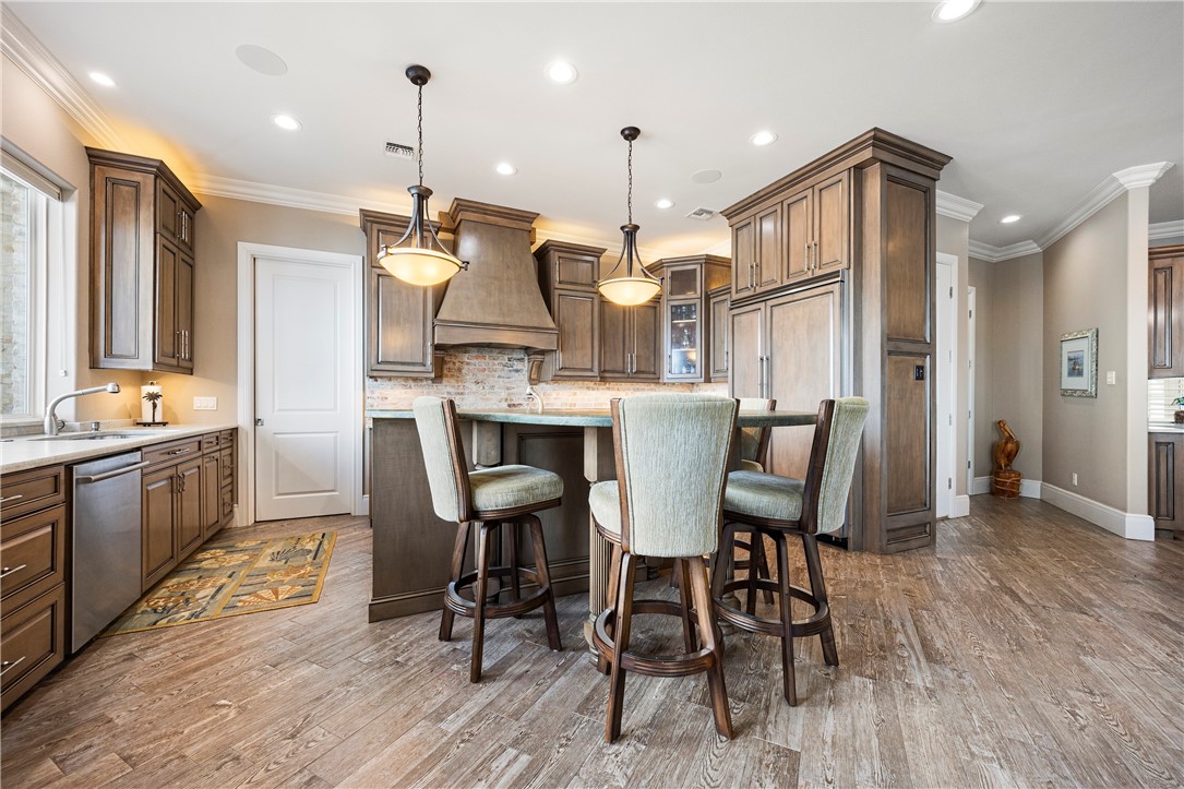 13806 Captains Row Corpus Christi, TX 78418 - Photo 7 of 40 a large kitchen with a table and chairs