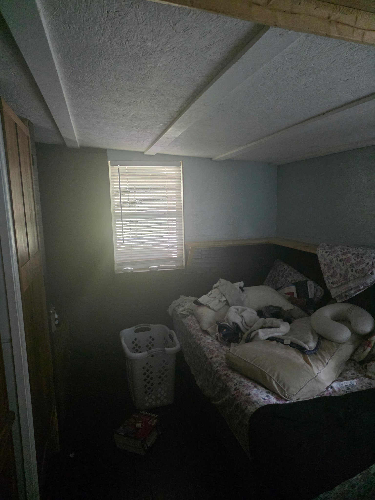 11 Pine Road Coldspring, TX 77331 - Photo 17 of 32 a bed sitting in a bedroom next to a window