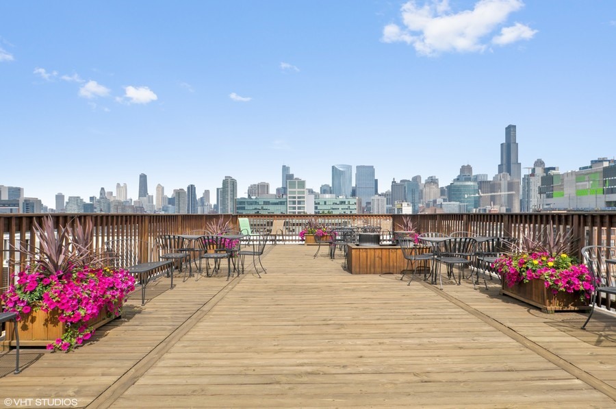 312 North May Street, Unit 2IJ Chicago, IL 60607 - Photo 16 of 19 a terrace with outdoor seating city view and barbeque oven