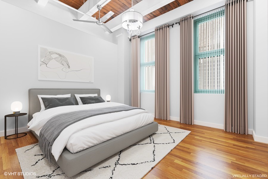 312 North May Street, Unit 2IJ Chicago, IL 60607 - Photo 7 of 19 a spacious bedroom with a bed and a window