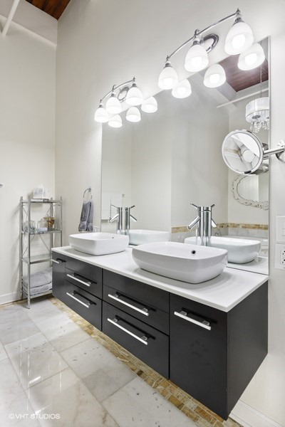 312 North May Street, Unit 2IJ Chicago, IL 60607 - Photo 9 of 19 a bathroom with a sink double vanity and a mirror