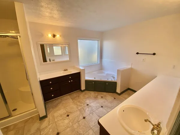 a view of an empty room with a floor to ceiling window