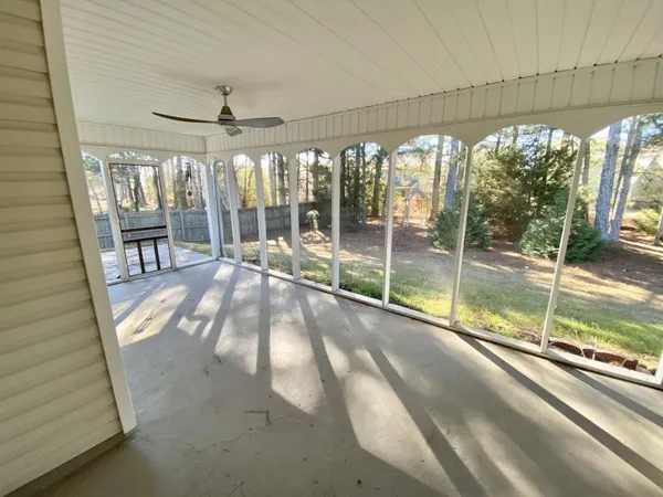 a view of a yard with a tree
