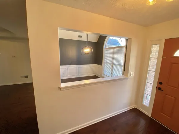 a view of a livingroom with wooden floor