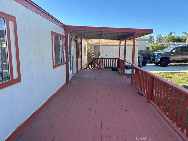 a view of a porch with wooden floor and outdoor space