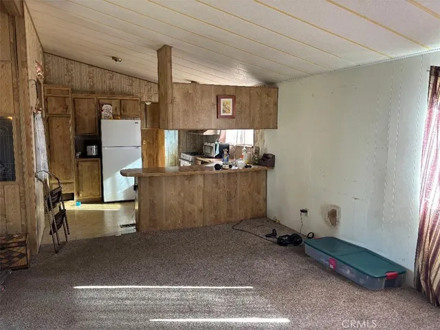 a room with a washing machine and mirrors