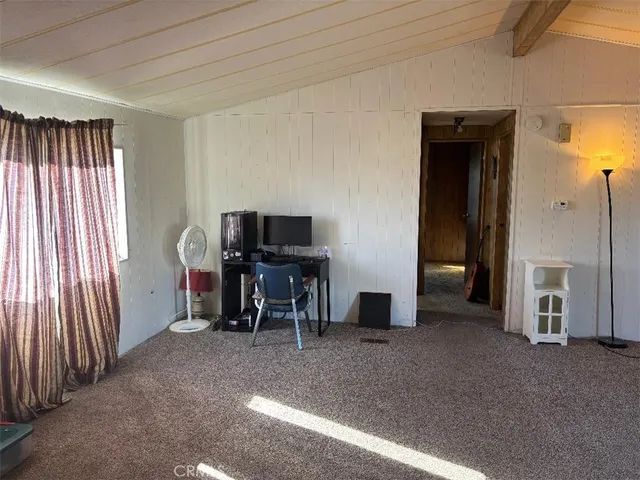 a view of a livingroom with furniture