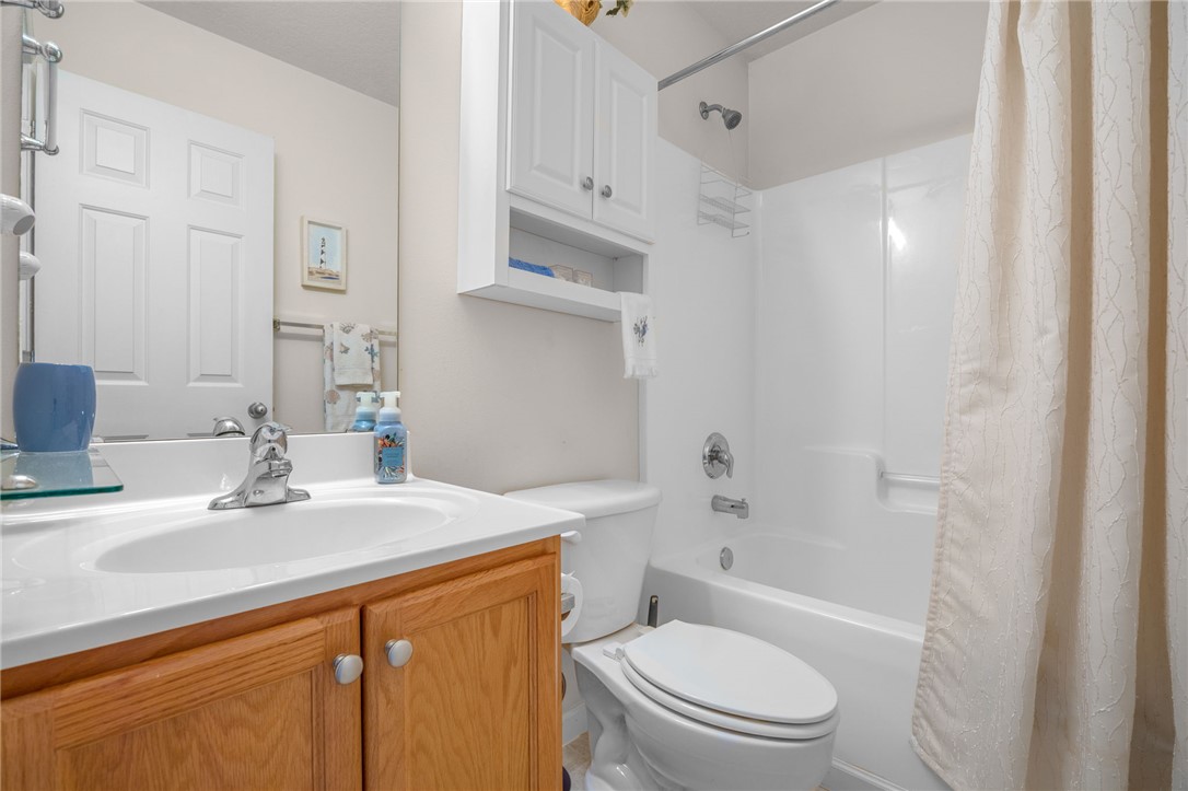 125 Patagonia Road Anderson, SC 29625 - Photo 21 of 36 Functional bathroom layout features a wood vanity, white solid surface countertop, and integrated tub shower.