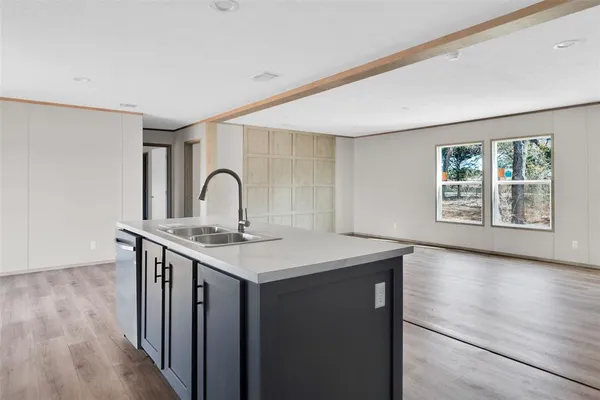 a room with a wooden floor and a window
