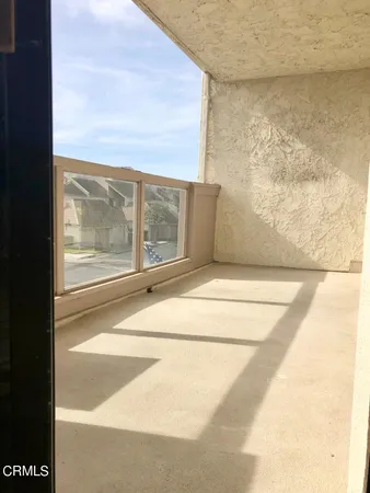 a view of a room with a floor to ceiling window