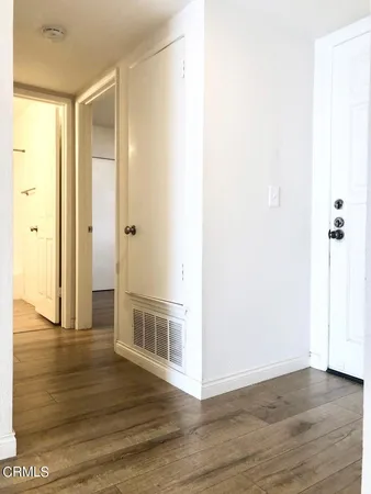 a view of a livingroom with wooden floor