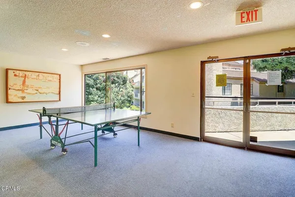 a view of a livingroom with furniture window and outside view