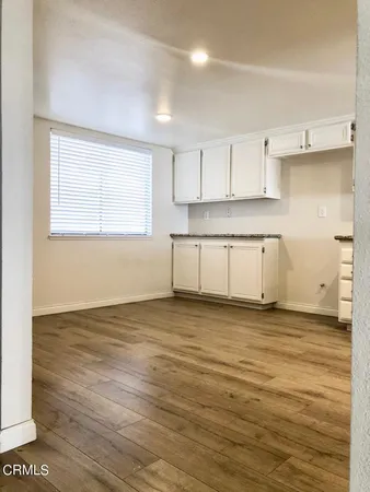 a view of a kitchen with a sink and a stove