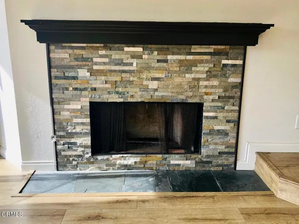 a living room with fireplace