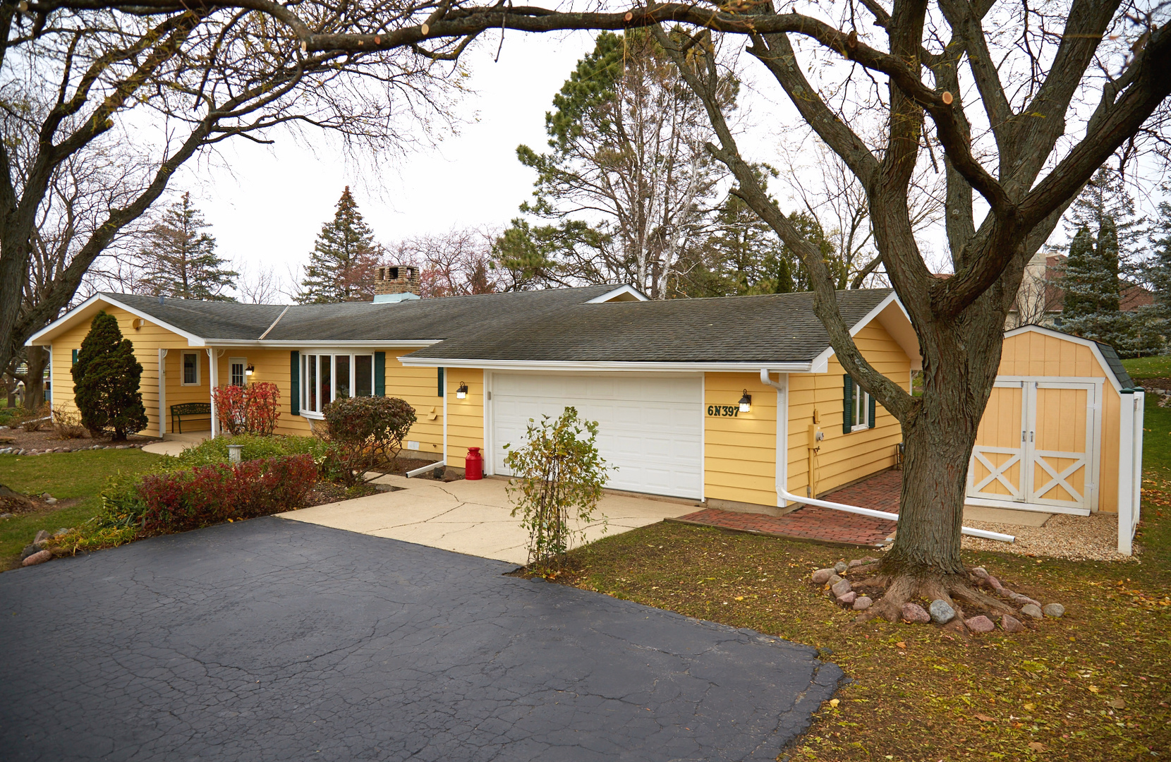 a view of a house with backyard porch and sitting area