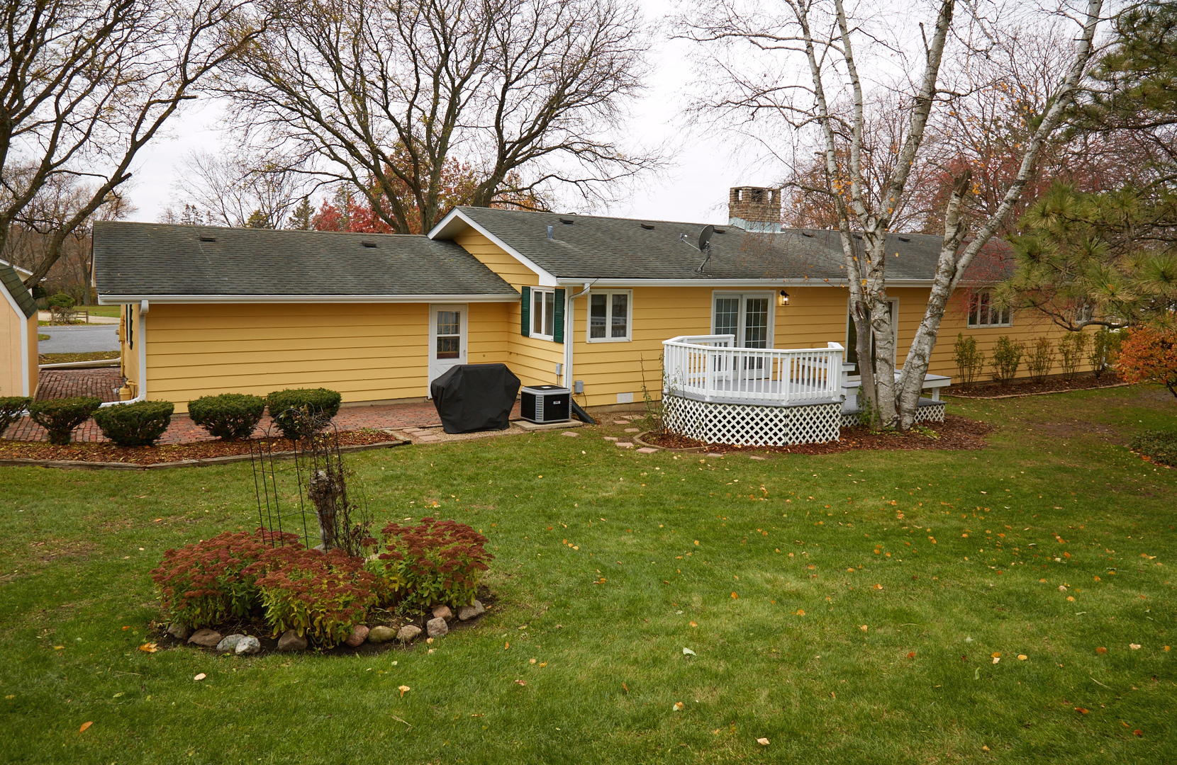 6N397 Corron Road St. Charles, IL 60175 - Photo 23 of 29 a front view of a house with a garden and trees