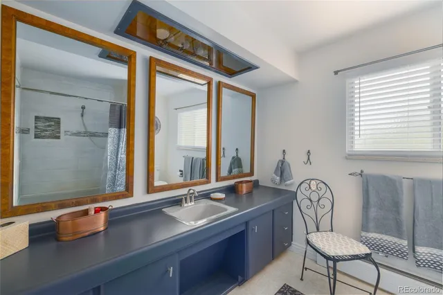 a room with a table chairs and wooden floor