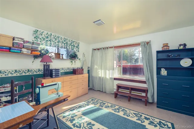 a room with furniture and a dresser