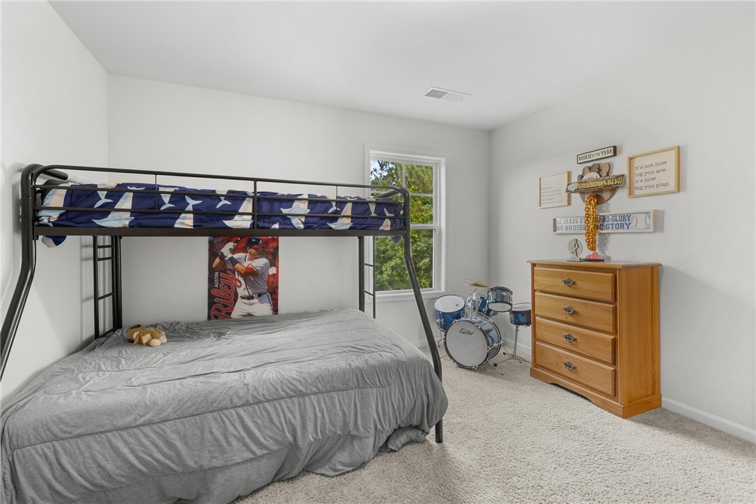 768 Rocky Ridge Circle Seneca, SC 29678 - Photo 19 of 30 A naturally illuminated bedroom offers a comfortable bunk bed and soft carpet flooring.