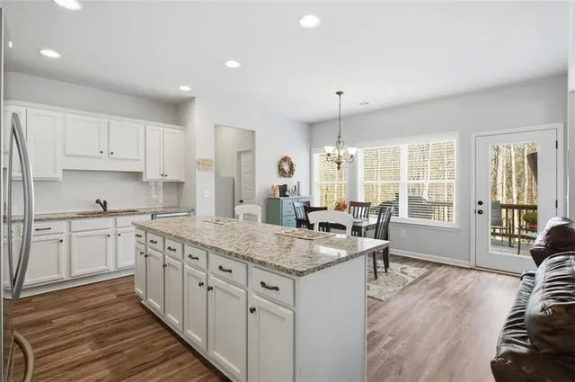 a kitchen with sink stove and cabinets