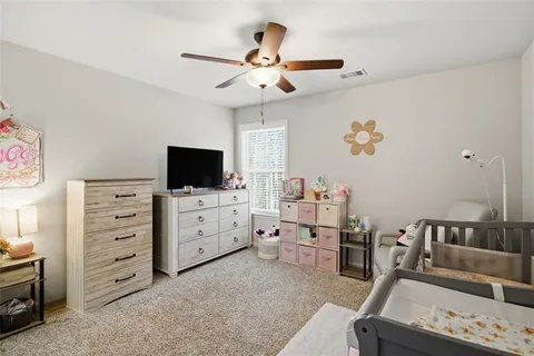 a bathroom with a double vanity sink toilet and a mirror