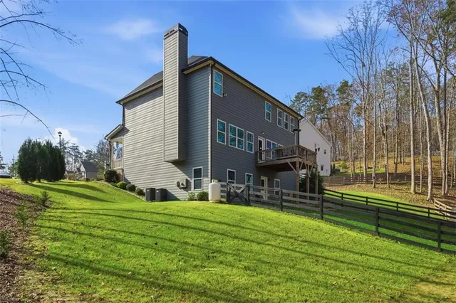 a view of a wooden door with a tree