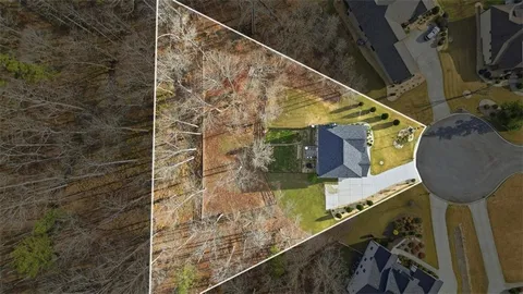 a view of a lake with a yard