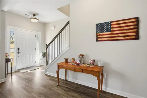 a room with wooden floor and furniture