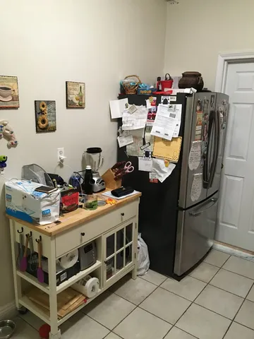 a bed room with a bed and gym equipment