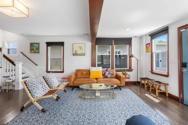 a living room with furniture and a table