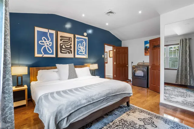 a bedroom with a bed and a lamp