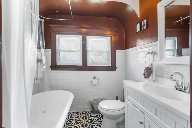 a bathroom with a bathtub and a shower