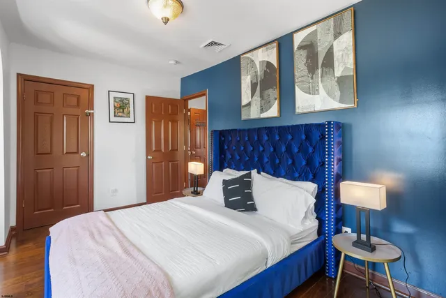 a bed room with a bed and a painting