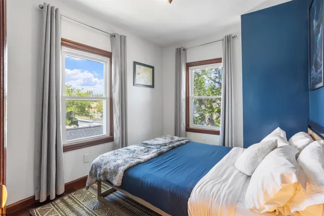 a bedroom with a bed and cabinets