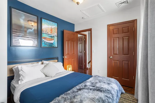 a view of a hallway with wooden floor and a window