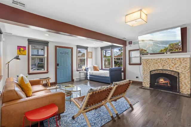 a living room with furniture and a fireplace