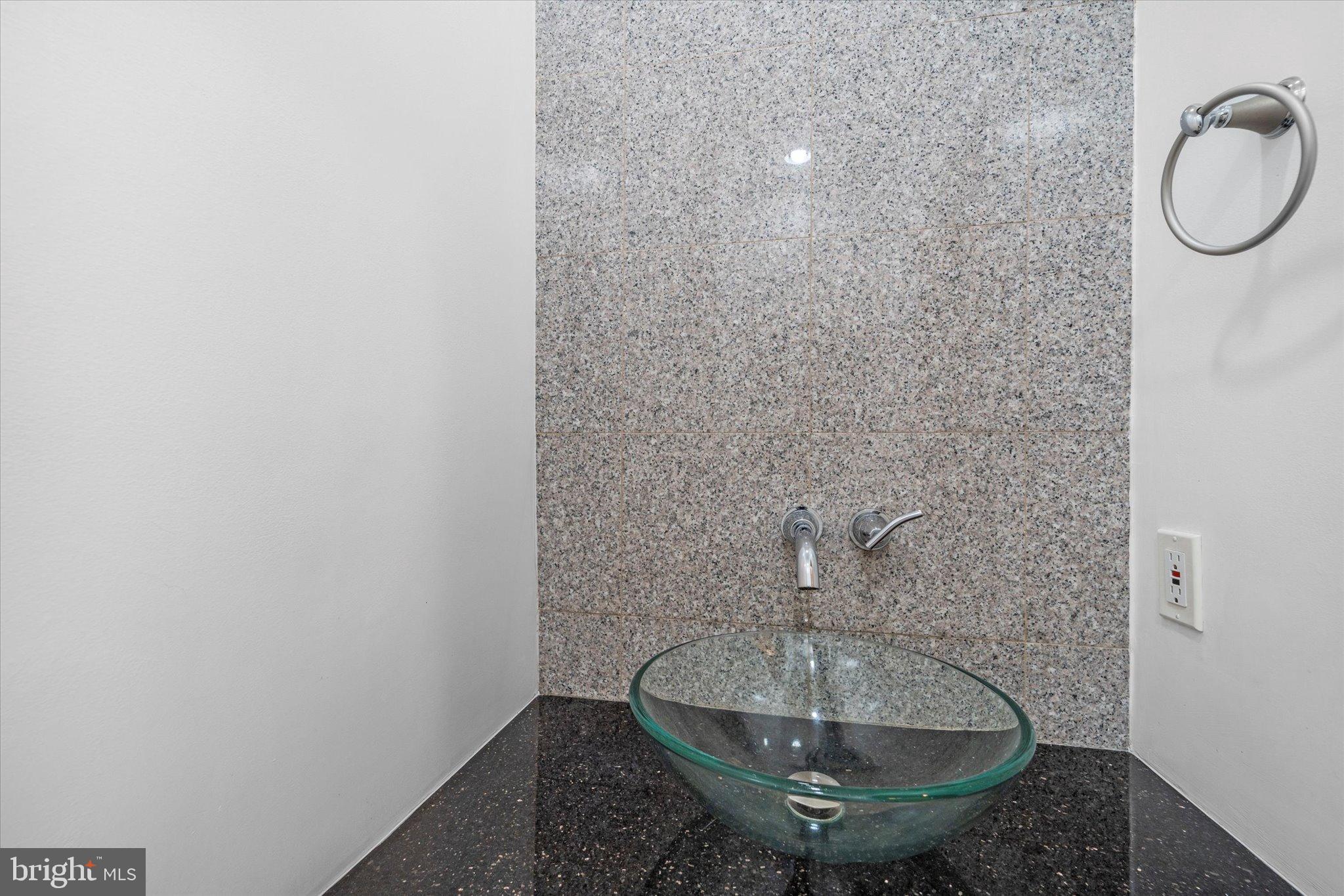 10276 Arizona Circle, Unit 61 Bethesda, MD 20817 - Photo 13 of 42 a bathroom with a sink and a mirror