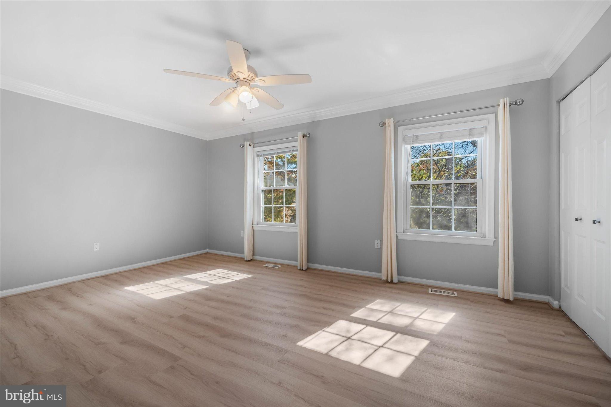 10276 Arizona Circle, Unit 61 Bethesda, MD 20817 - Photo 16 of 42 wooden floor in an empty room with a window