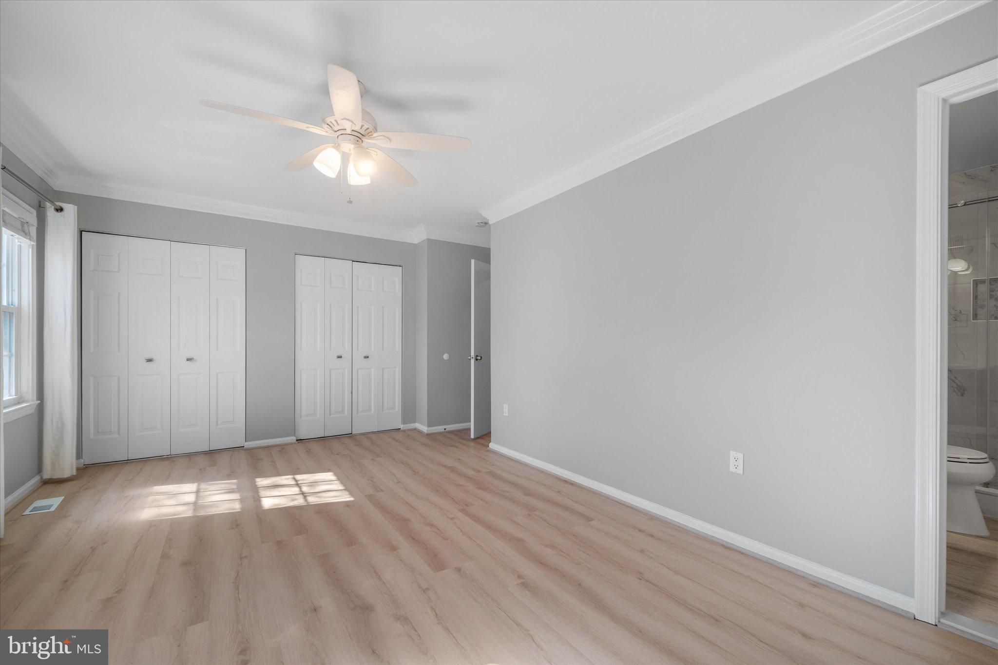 10276 Arizona Circle, Unit 61 Bethesda, MD 20817 - Photo 18 of 42 a view of empty room with wooden floor and fan