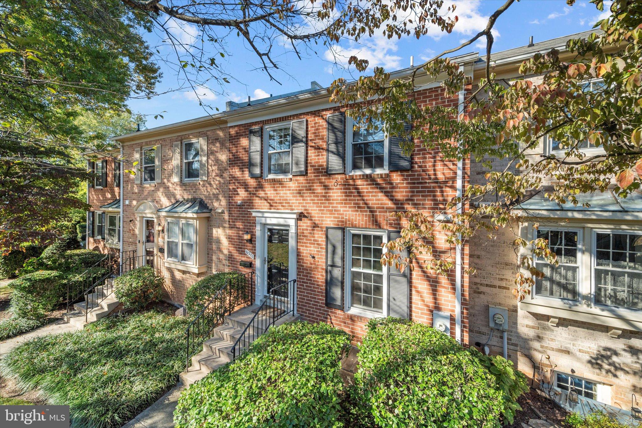 10276 Arizona Circle, Unit 61 Bethesda, MD 20817 - Photo 2 of 42 front view of a building with a yard
