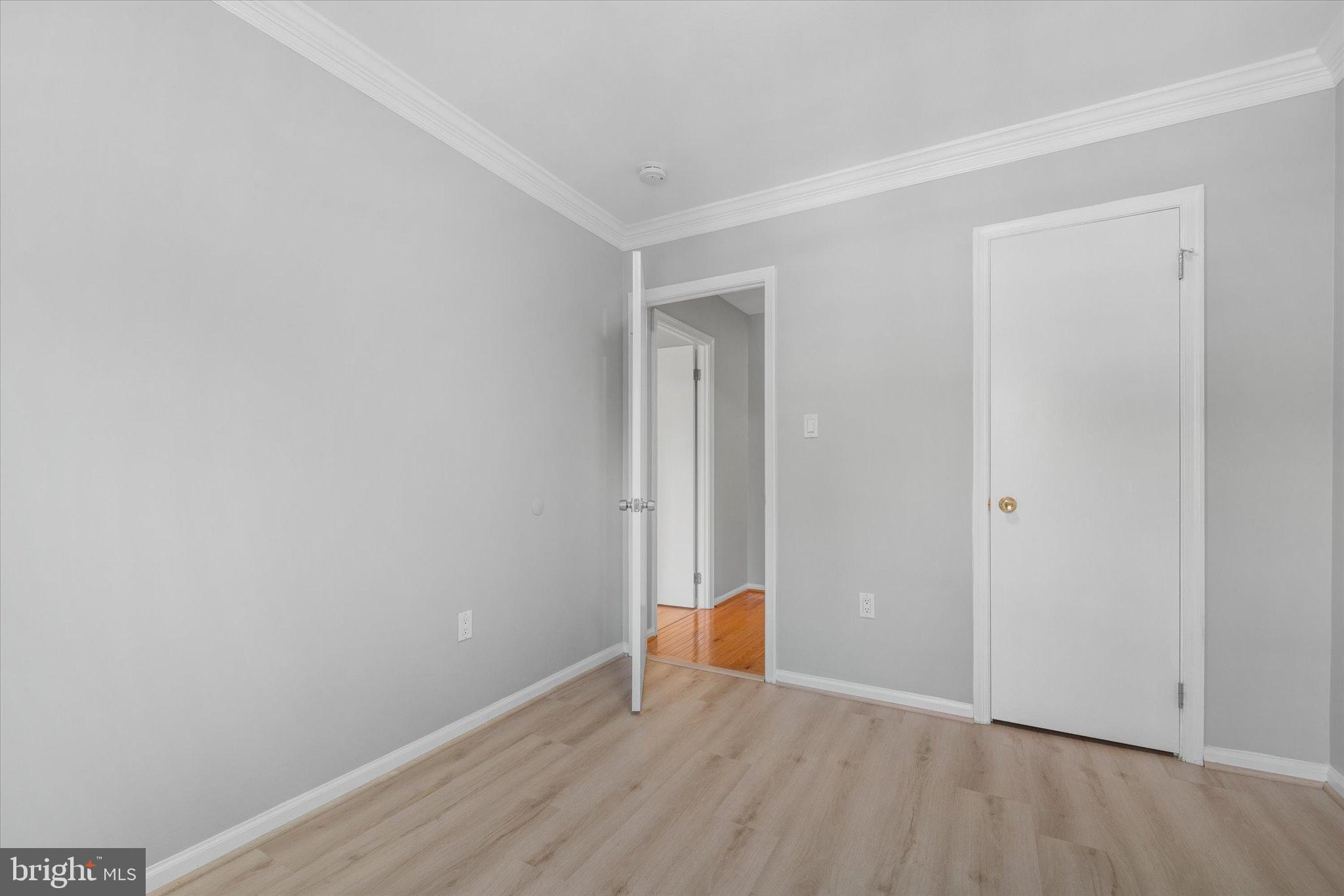 10276 Arizona Circle, Unit 61 Bethesda, MD 20817 - Photo 21 of 42 a view of an empty room with wooden floor
