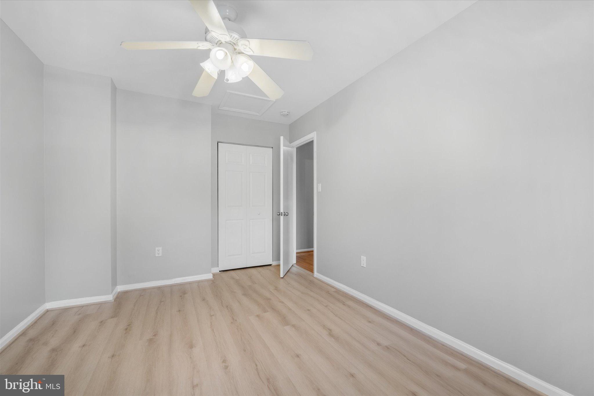 10276 Arizona Circle, Unit 61 Bethesda, MD 20817 - Photo 23 of 42 a view of an empty room with wooden floor